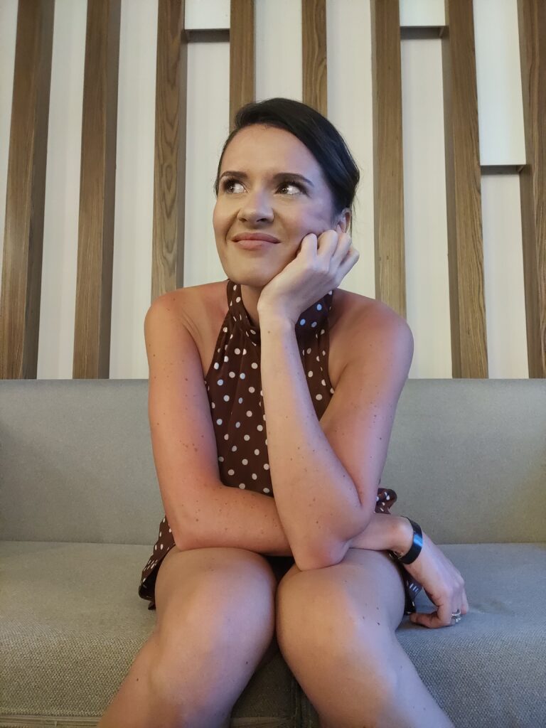 Claire Innes The Fertility Mentor Sitting On Couch Pondering.